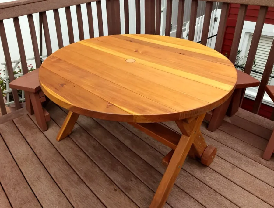 Round Wood Picnic Table with Wheels (Options: 4' Diameter, No Seating, Redwood, Standard Tabletop, No Lazy Susan, 2" Umbrella Hole, Transparent Premium Sealant). Photo Courtesy of L. Roberts of Hermosa Beach, CA.