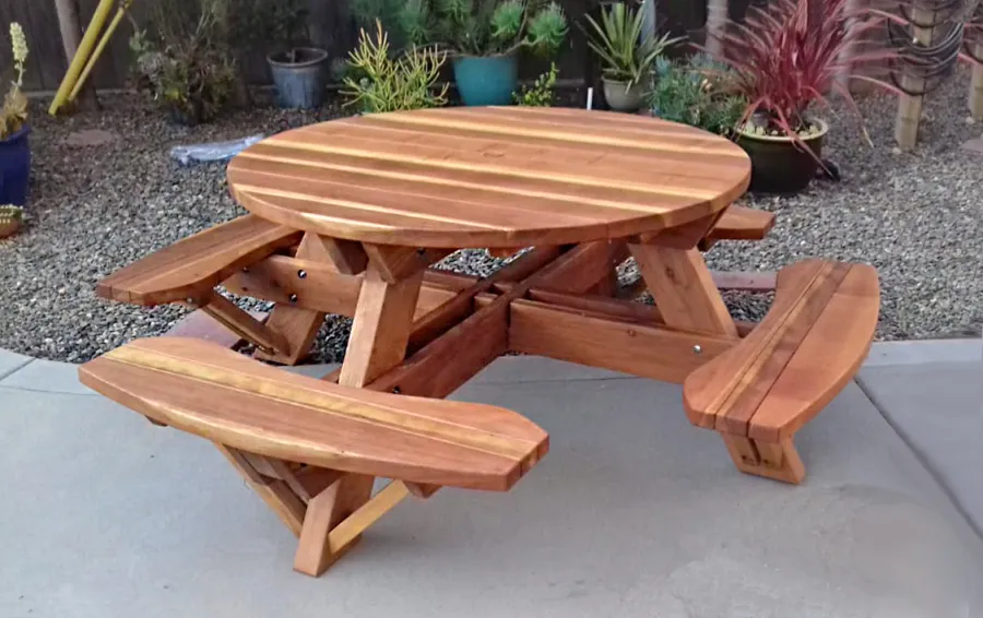 Round Wooden Picnic Tables (Attached Benches) (Options: 4.5' Diameter, Attached Benches, California Redwood, Standard Tabletop, No Lazy Susan, 1 5/8" Diameter Umbrella Hole & Plug, Transparent Premium Sealant). Photo Courtesy of B. Shushan of Carlsbad, CA.