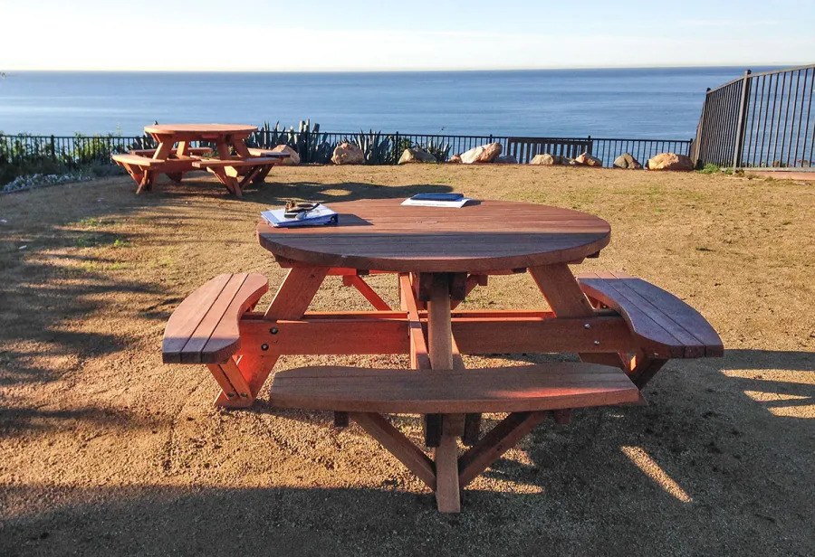 Round Wooden Picnic Tables (Attached Benches) (Options: 4 1/2' Diameter, Attached Benches, Douglas-fir, Standard Tabletop, No Lazy Susan, 2" Umbrella Hole & Plug, Transparent Premium Sealant). Photo Courtesy of Cynthia Hirschhorn of Pacific Palisades, CA.