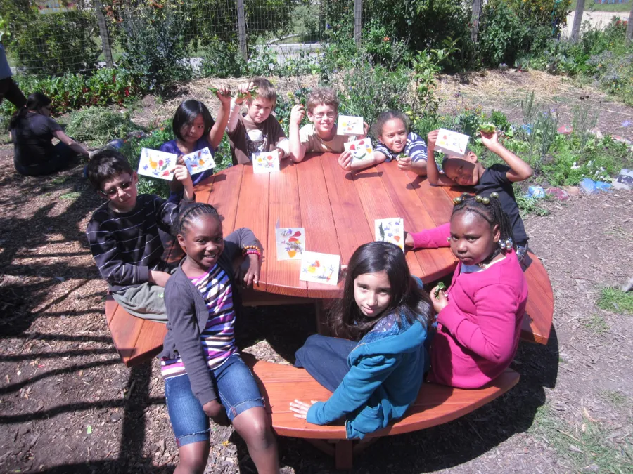 Round Wooden Picnic Tables (Attached Benches) (Options: 5' Diameter, Attached Benches, California Redwood, Standard Tabletop, No Lazy Susan, No Umbrella Hole, Transparent Premium Sealant). Photo courtesy of Rivka M. of Berkeley, CA. 