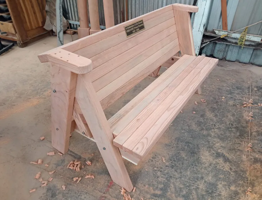 Rustic Redwood Bench (Options: 5 ft, Mature Redwood, No Cushion, No Engraving - Plaque made locally and shipped to us for inlaying and installation). Photo Taken in Production. 