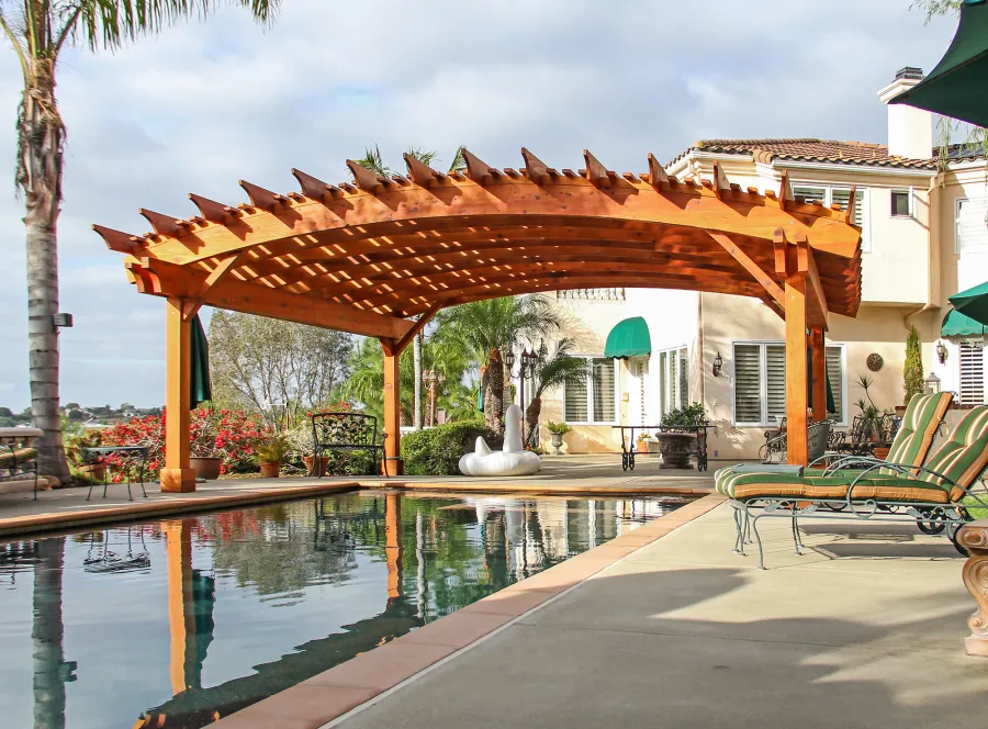 Sebastopol Pergolas (Options: 26' L x 24' Arc W, Mature Redwood, 4-Post Anchor Kit for High-Wind, Transparent Premium Sealant). Photo Courtesy of Ms. Diane Williams of Encinitas, CA. Photo shows extra large timber custom design with 8x8 posts and 2x10 arches, 26 ft long.