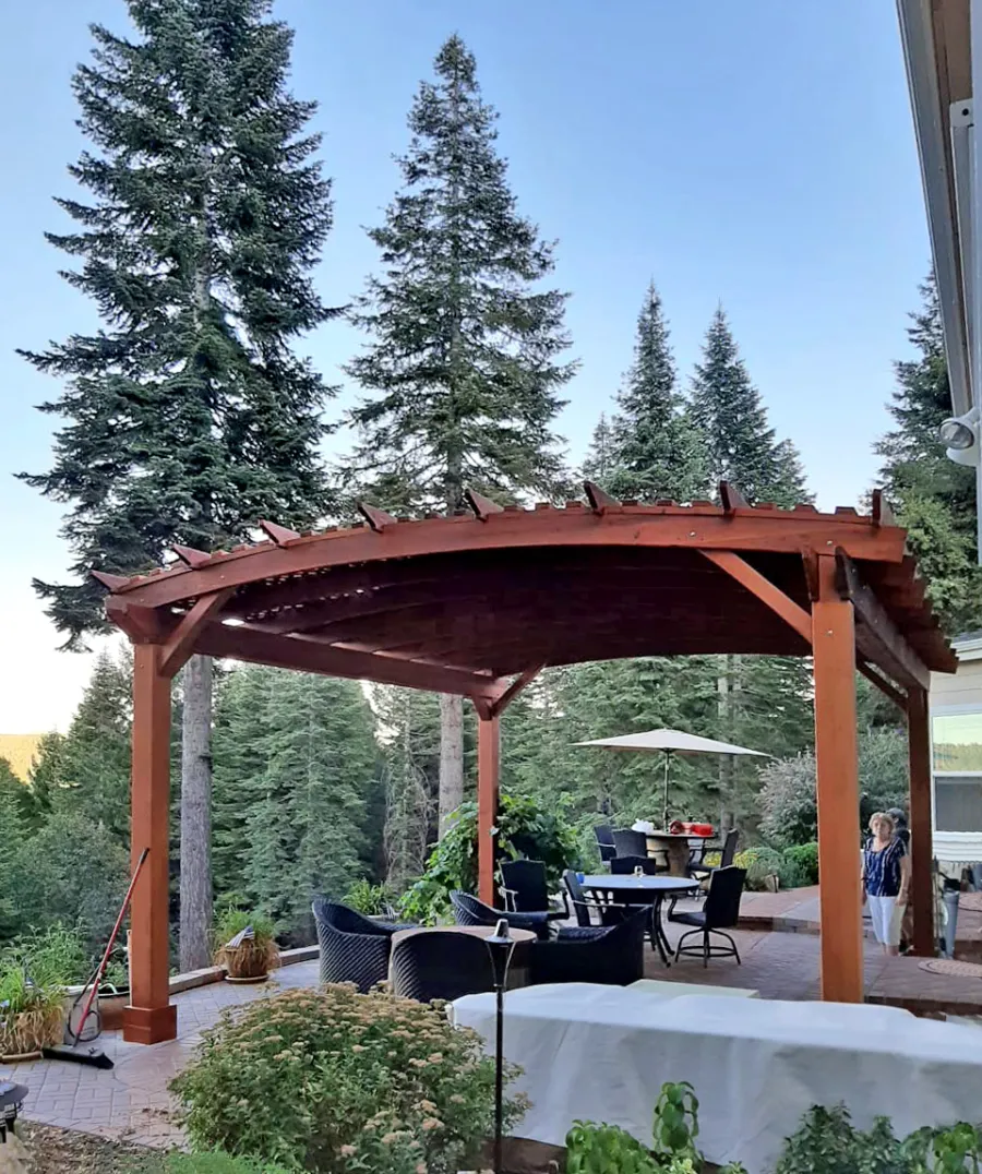 Custom Sebastopol Pergolas (Options: 20' L x 18' Arc W, California Redwood, 4-Post Anchor Kit for Concrete, with Lattice Panels by Custom Request, No Ceiling Fan Base, 10' H Posts, Transparent Premium Sealant). Photo Courtesy of E. Greenwood of Nevada City, California.