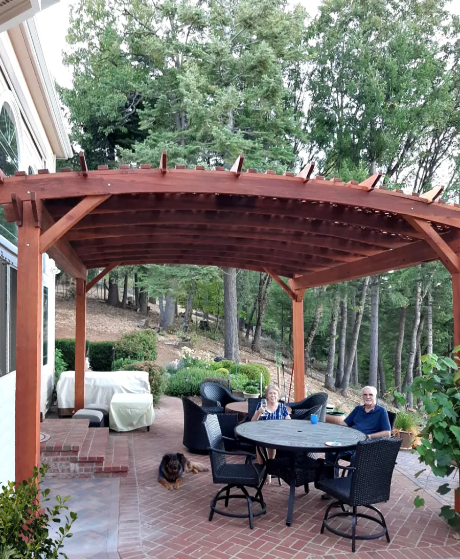Custom Sebastopol Pergolas (Options: 20' L x 18' Arc W, California Redwood, 4-Post Anchor Kit for Concrete, with Lattice Panels by Custom Request, No Ceiling Fan Base, 10' H Posts, Transparent Premium Sealant). Photo Courtesy of E. Greenwood of Nevada City, California.