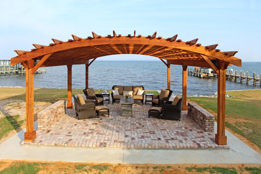 Sebastopol Pergolas (Options: 32' L x 24' Arc W, California Redwood, 6-Post Anchor Kit for High-Wind, No Ceiling Fan Base, Transparent Premium Sealant). Photo Courtesy of J. Graves of Santa Rosa Beach, Florida.