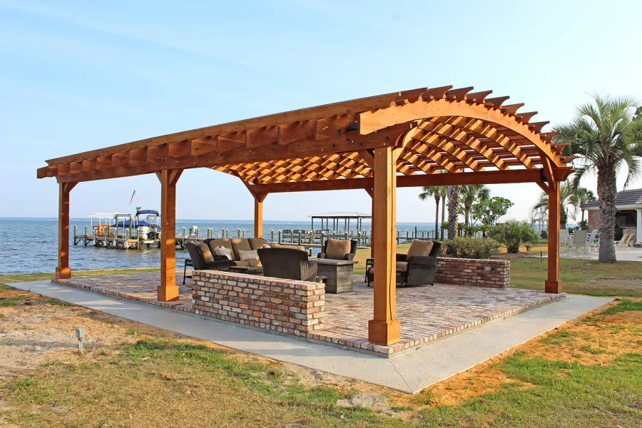 Sebastopol Pergolas (Options: 32' L x 24' Arc W, California Redwood, 6-Post Anchor Kit for High-Wind, No Ceiling Fan Base, Transparent Premium Sealant). Photo Courtesy of J. Graves of Santa Rosa Beach, Florida.