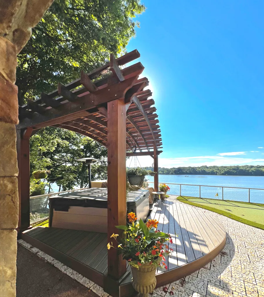 Custom Sebastopol Pergola (Options: 22' L x 12' Arc W, California Redwood, 4-Post Anchor Kit for Concrete, 2 Ceiling Fan Bases, 10.5' H Posts, Viking End Cut for Supports & Rafters, Transparent Premium Sealant). Photo Courtesy of K. Johnson of Gallatin, TN.