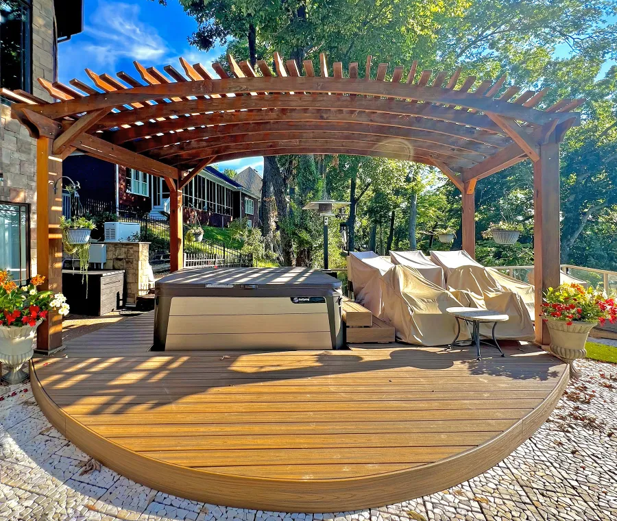 Custom Sebastopol Pergola (Options: 22' L x 12' Arc W, California Redwood, 4-Post Anchor Kit for Concrete, 2 Ceiling Fan Bases, 10.5' H Posts, Viking End Cut for Supports & Rafters, Transparent Premium Sealant). Photo Courtesy of K. Johnson of Gallatin, TN.