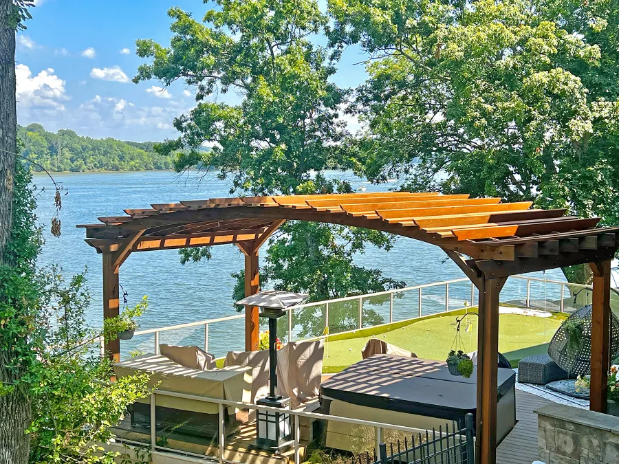 Custom Sebastopol Pergola (Options: 22' L x 12' Arc W, California Redwood, 4-Post Anchor Kit for Concrete, 2 Ceiling Fan Bases, 10.5' H Posts, Viking End Cut for Supports & Rafters, Transparent Premium Sealant). Photo Courtesy of K. Johnson of Gallatin, TN.