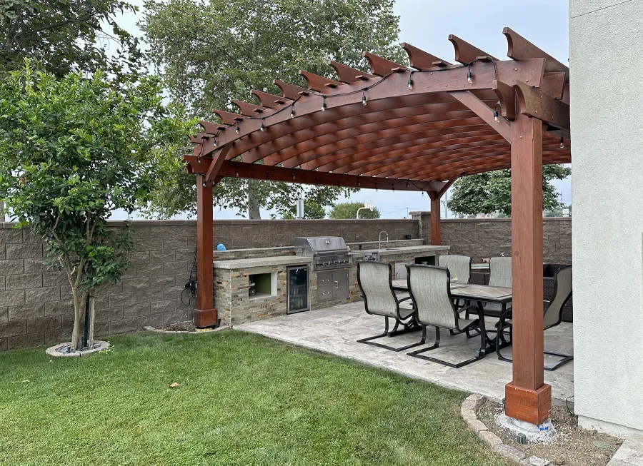 Custom Sebastopol Pergola (Options: 28' L x 18' Arc W, California Redwood, 5-Post Anchor Kit for High-Wind, No Ceiling Fan Base, with Transparent Premium Sealant). Photo Taken 5 Years After Installation. Photo Courtesy of R. Shue of Carlsbad, CA.
