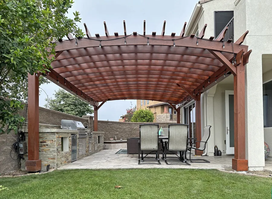 Custom Sebastopol Pergola (Options: 28' L x 18' Arc W, California Redwood, 5-Post Anchor Kit for High-Wind, No Ceiling Fan Base, with Transparent Premium Sealant). Photo Taken 5 Years After Installation. Photo Courtesy of R. Shue of Carlsbad, CA.