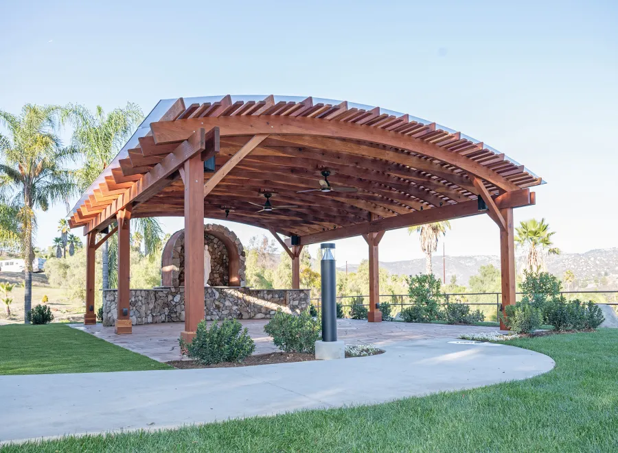 Sebastopol Pergola (Options: 30' L x 24' Arc W, California Redwood, 4 Electrical Wiring Trims, Post Anchor Kit for Concrete, with Rain Guard, 2 Ceiling Fan Bases, Flash End Cuts, 9' Post Height, Transparent Premium Sealant). Photo Courtesy of the Sycuan Casino of San Diego, CA.