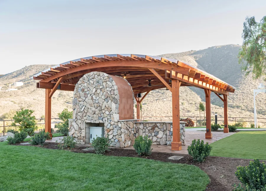 Sebastopol Pergola (Options: 30' L x 24' Arc W, California Redwood, 4 Electrical Wiring Trims, Post Anchor Kit for Concrete, with Rain Guard, 2 Ceiling Fan Bases, Flash End Cuts, 9' Post Height, Transparent Premium Sealant). Photo Courtesy of the Sycuan Casino of San Diego, CA.