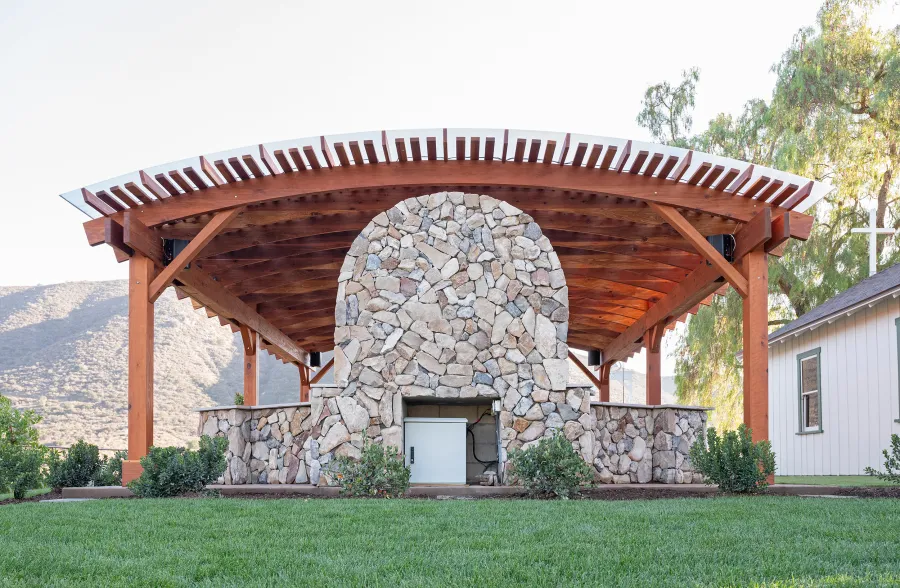 Sebastopol Pergola (Options: 30' L x 24' Arc W, California Redwood, 4 Electrical Wiring Trims, Post Anchor Kit for Concrete, with Rain Guard, 2 Ceiling Fan Bases, Flash End Cuts, 9' Post Height, Transparent Premium Sealant). Photo Courtesy of the Sycuan Casino of San Diego, CA.