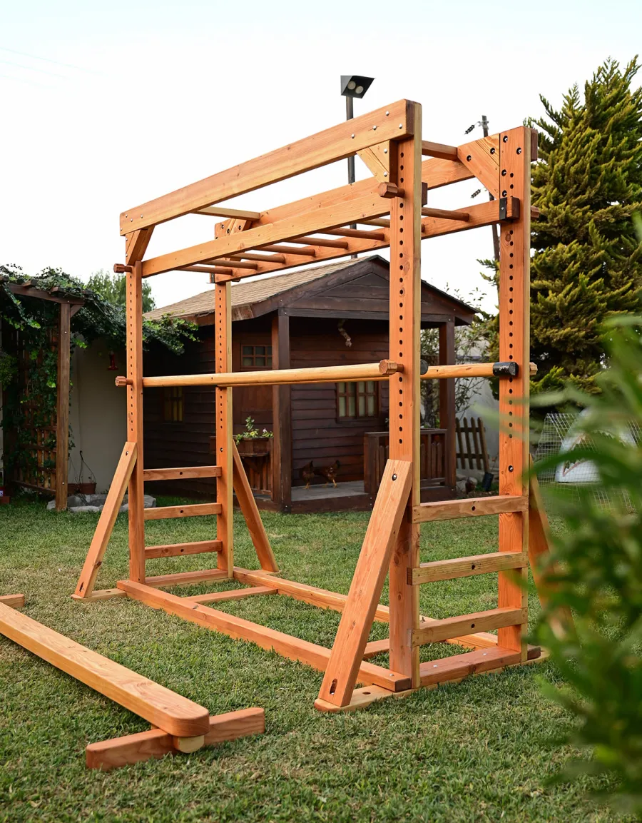 Custom Sheldon's Monkey Bars (Options: 8 ft H, 108.5 ft L, Douglas-fir, Standard Step Option, Transparent Premium Sealant) with Balance Beam and Parallel Bars. Extra Supports Added at the Bottom of the Monkey Bar. Balance Beam Can be Removed and Used Independently.