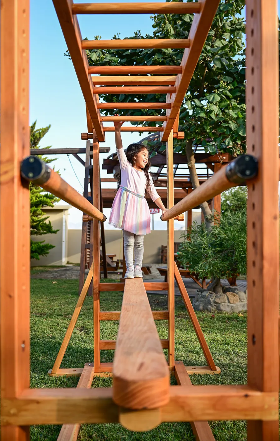 Custom Sheldon's Monkey Bars (Options: 8 ft H, 108.5 ft L, Douglas-fir, Standard Step Option, Transparent Premium Sealant) with Balance Beam and Parallel Bars. Extra Supports Added at the Bottom of the Monkey Bar. Balance Beam Can be Removed and Used Independently.