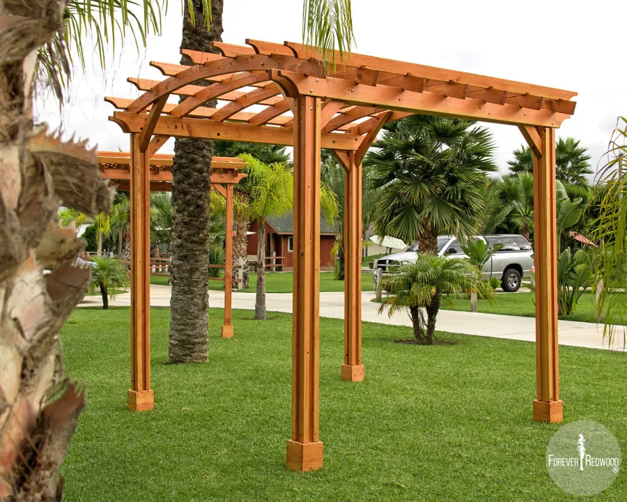 Small Arched Open Sky Pergolas (Options: 10' L x 10' W, No Privacy Panels, Douglas-Fir, No Rain Guard, 9 ft Post Height, No Electrical Wiring Trim, Vertical Decorative Trim, 4-Post Anchor Kit for Concrete, No Curtain Rods, No Retractable Shade Canopy, Transparent Premium Sealant).
