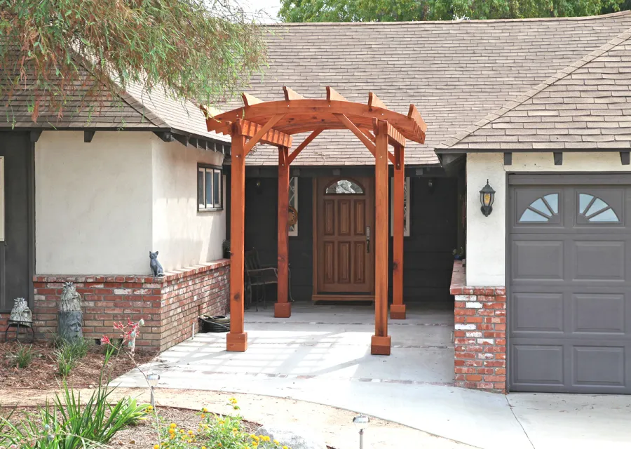 Small Arched Open Sky Pergolas (Options: 15' L x 8' W, No Privacy Panels, Mature Redwood, No Rain Guard, 8.5 ft Post Height, No Electrical Wiring Trim, No Post Decorative Trim, 4-Post Anchor Kit for Concrete, No Curtain Rods, No Retractable Shade Canopy, Transparent Premium Sealant). Photo Courtesy of B. McCusker of Glendora, CA.