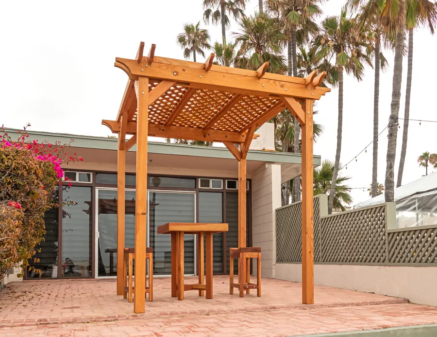 Small Lattice Pergola  (Options: 8' L x 8' W, No Privacy Panels, Douglas-fir, No Rain Guard, 8 ft Post Height, No Electrical Wiring Kit, No Post Decorative Trim, No Anchor Kit, No Curtain Rods, No Retractable Shade Canopy, Transparent Premium Sealant). Glady's Balcony Table Set Under the Pergola.
