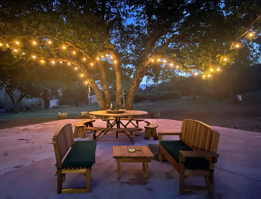 Square Side Table (Options: 30" Size, California Redwood, Slightly Rounded Corners, 18" H, Transparent Premium Sealant). Photo also shows 2 Moonlight Benches and a Custom Round Picnic Table Set. Photo Courtesy of A. Paul of Lower Lake, CA.