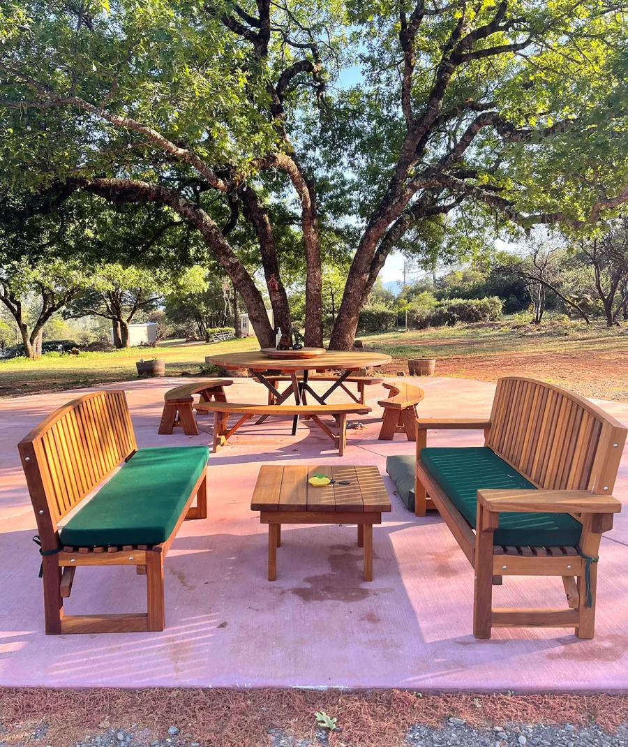 Square Side Table (Options: 30" Size, California Redwood, Slightly Rounded Corners, 18" H, Transparent Premium Sealant). Photo also shows 2 Moonlight Benches and a Custom Round Picnic Table Set. Photo Courtesy of A. Paul of Lower Lake, CA.