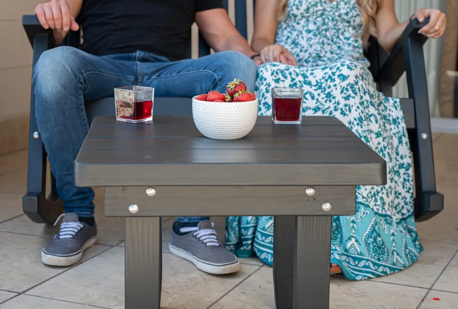 Square Side Table (Options: 23" Size, Mature Redwood, Rounded Corners, 18" H, Black Stain Premium Sealant) with a Massive Rocking Bench.