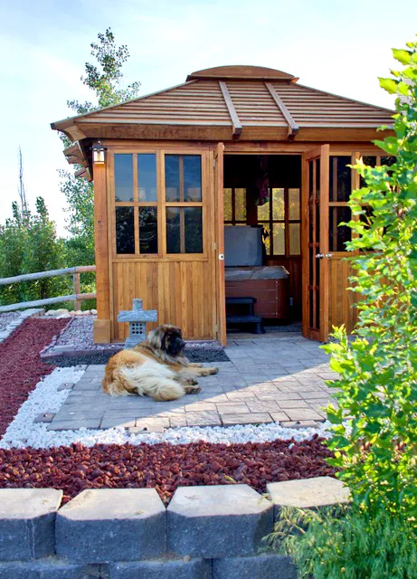Spa Gazebo Kit (Options: 12' L, 10' W, California Redwood, All Sliding Windows with Screens, 4' x 4' Skylight, 36" H Siding Below Windows, Vertical Siding, French Doors without Screens, No Flooring, Transparent Premium Sealant). Photo Courtesy of B. Whiteaker of Corvallis, Montana.