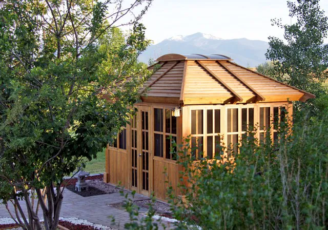 Spa Gazebo Kit (Options: 12' L, 10' W, California Redwood, All Sliding Windows with Screens, 4' x 4' Skylight, 36" H Siding Below Windows, Vertical Siding, French Doors without Screens, No Flooring, Transparent Premium Sealant). Photo Courtesy of B. Whiteaker of Corvallis, Montana.