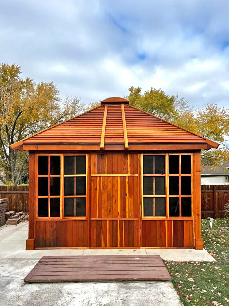 Custom Spa Gazebo Kit (Options: 12' L, 12' W, California Redwood, Combination of Fixed and Sliding Windows, 2' x 4' Skylight, 30" H Siding Below Windows, Vertical Siding, Japanese Doors with Screens, Custom Pitch, Shiplap Roof, No Flooring, Transparent Premium Sealant). Photo Courtesy of A. Calatayud of Savage, MN.
