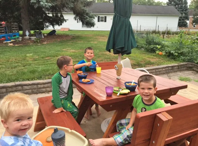 Square Heritage Large Wooden Picnic Table (Options: 46" x 46" Tabletop, Side Benches and Fullback End Benches, Standard Tabletop, Rounded Corners, 2" Umbrella Hole, Transparent Premium Sealant). Photo Courtesy of M. Kellett of York, PA.