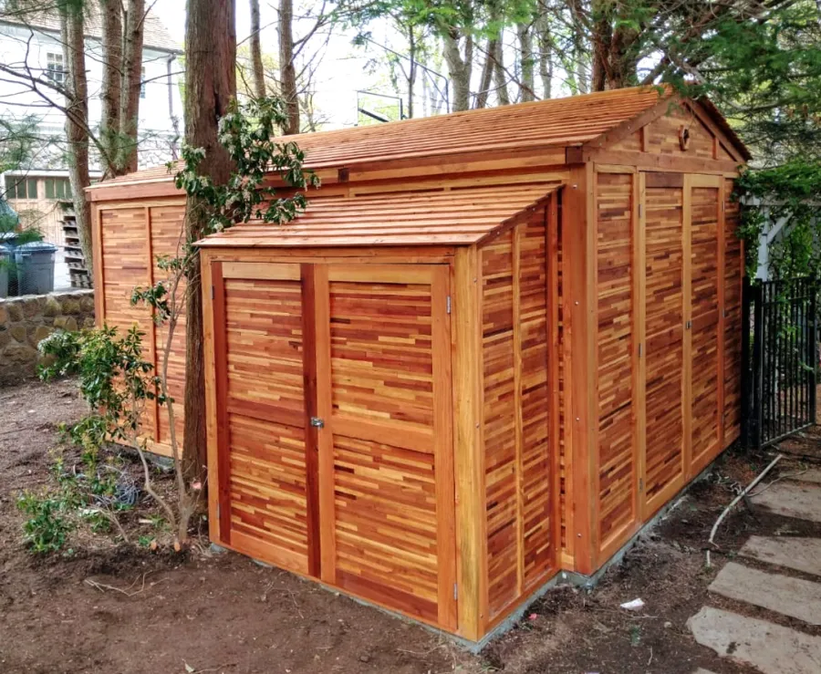Storage Mini Barns (Options: 11' W, 15' D, 8' H, Mosaic Redwood, Double Doors Opening Out From Center, No Shelves, Transparent Premium Sealant).  A Storage Shed Shown in Front of the Storage Mini Barn. Photo Courtesy of Jake VanderKamp of Westport, Connecticut.