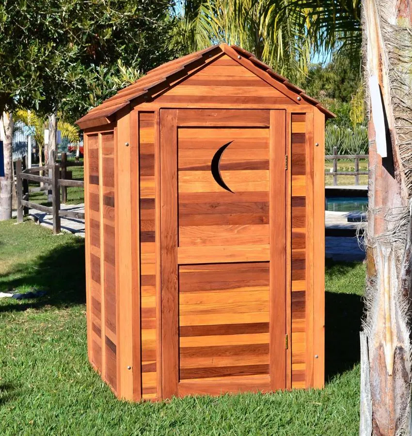 Storage Mini Barns (Options: 4.5' W, 4.5' D, 7' H, California Redwood, Single Door, Transparent Premium Sealant). Crescent Moon cutout was optional request by customer.