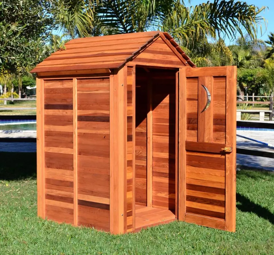 Storage Mini Barns (Options: 4.5' W, 4.5' D, 7' H, California Redwood, Single Door, Transparent Premium Sealant). Crescent Moon cutout was optional request by customer.