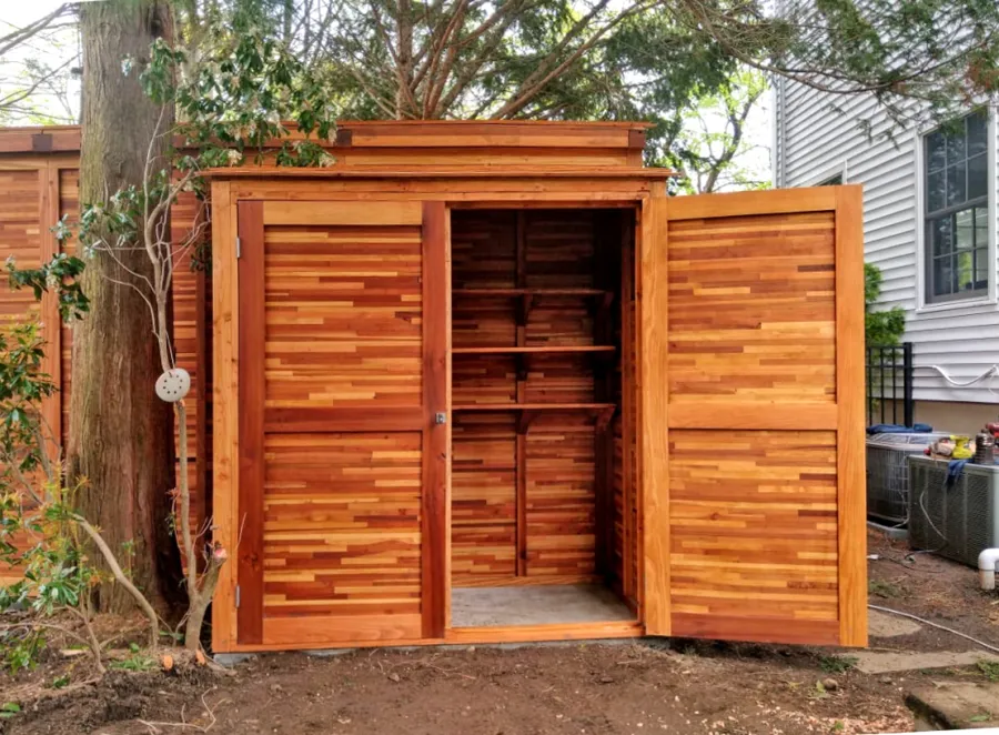 Storage Sheds (Options: 7' W, 3' D, 7' H, Mosaic Redwood, Double Doors, Three Shelves at 28" H & 14" H, Transparent Premium Sealant). Photo Also Shows a Storage Mini Barn. Photo Courtesy of J. VanderKamp of Westport, Connecticut.