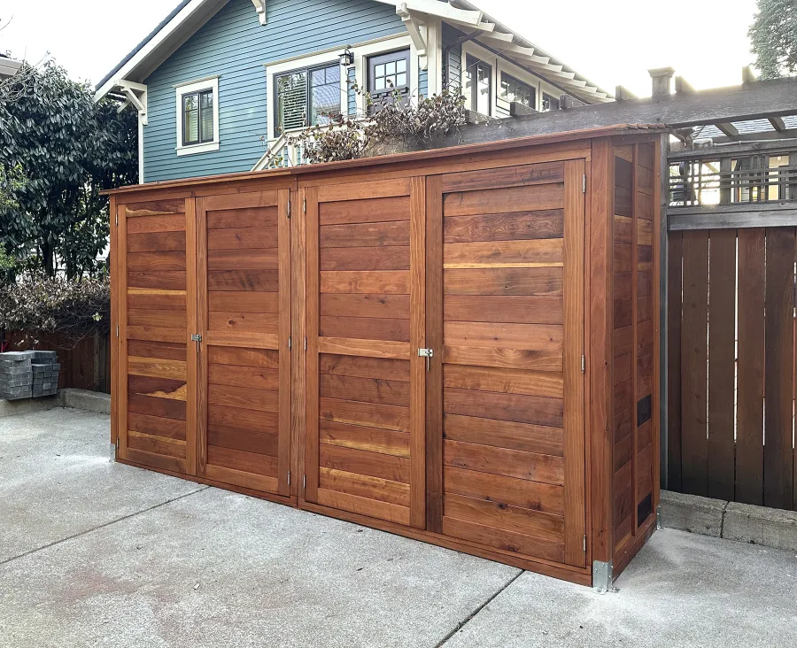 Storage Shed (Options: 12' W, 3' D, 7' H, California Redwood, Double Doors Opening Out From Center, No Shelving, with Interior Flooring, Hardware Kit for Concrete, Transparent Premium Sealant). Photo Courtesy of K. Bennett of Portland, OR.