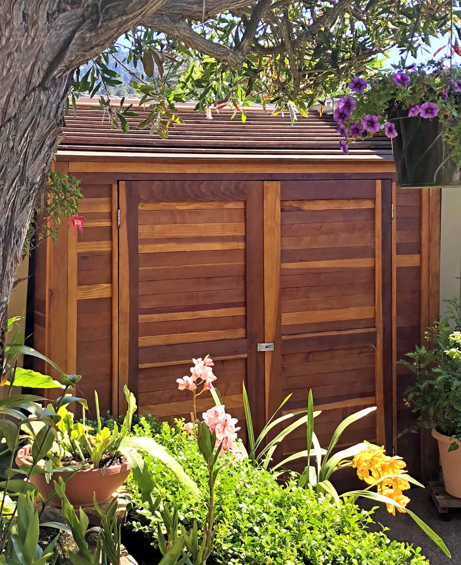 Storage Sheds (Options: 7' W, 4.5' D, 7' H, California Redwood, Double Doors, No Shelving, With Deck, Transparent Premium Sealant). Photo Courtesy of I. Speiser of Carmel, CA