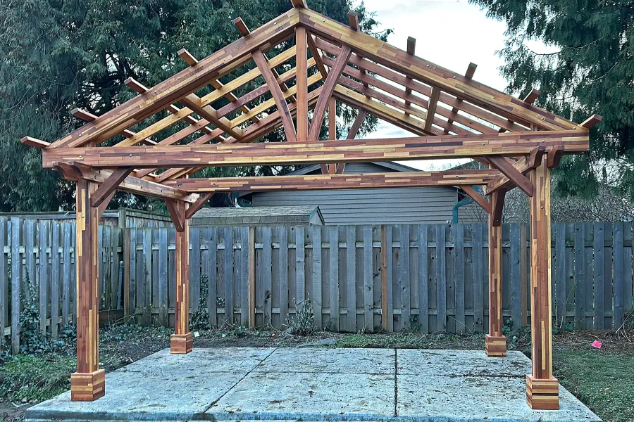 Breezy Pavilion Under Construction (Options: 10' L x 16' W, Mosaic Redwood, 8.5' H Posts, Transparent Premium Sealant).