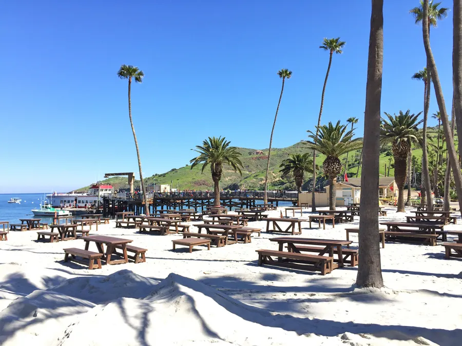 Classic Redwood Patio Table (Options: California Redwood, Side Benches, 1 Full Length Bench Per Side, Standard Tabletop, Slightly Rounded Corners, No Umbrella Hole, Coffee Stain Premium Sealant). Photo Shows Customized Version of Patio Tables. Tables Installed in Catalina Island, CA.