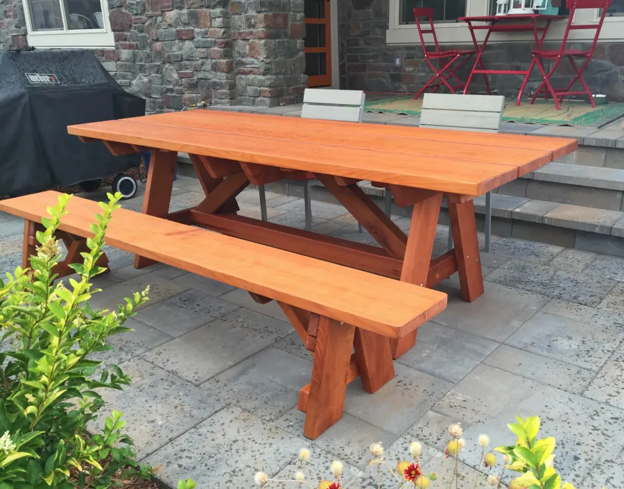 Classic Redwood Patio Table (Options: 8' L, 34 ½" W, Side Bench, Mature Redwood, 1 Full Length Side Bench on One Side, Custom Tabletop [3-Plank Bookmatch Top], Slightly Rounded Corners, No Umbrella Hole, Transparent Premium Sealant). Photo Courtesy of J. Gannon of Broomfield, CO.