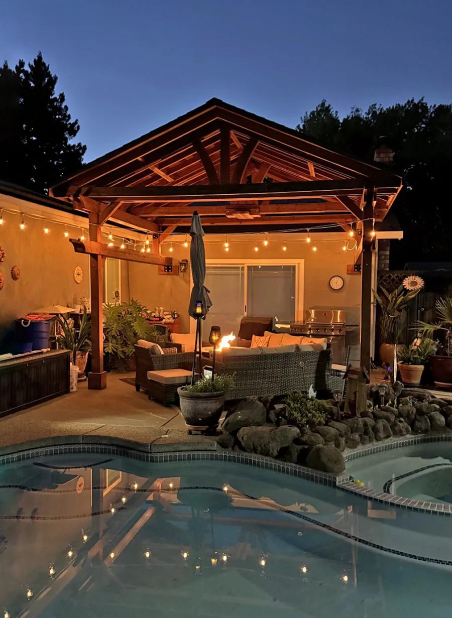 Custom Del Norte Porch Pavilion (Options: 14' L x 16' W, California Redwood, 2-Post Anchor Kit for Concrete, 10.5' H Posts, 1 Ceiling Fan Base, No Electrical Wiring Trim Kit, No Post Decorative Trims, Transparent Premium Sealant). Photo Taken 2 Years After Installation. Photo Courtesy of R. Dakin of Vacaville, CA.