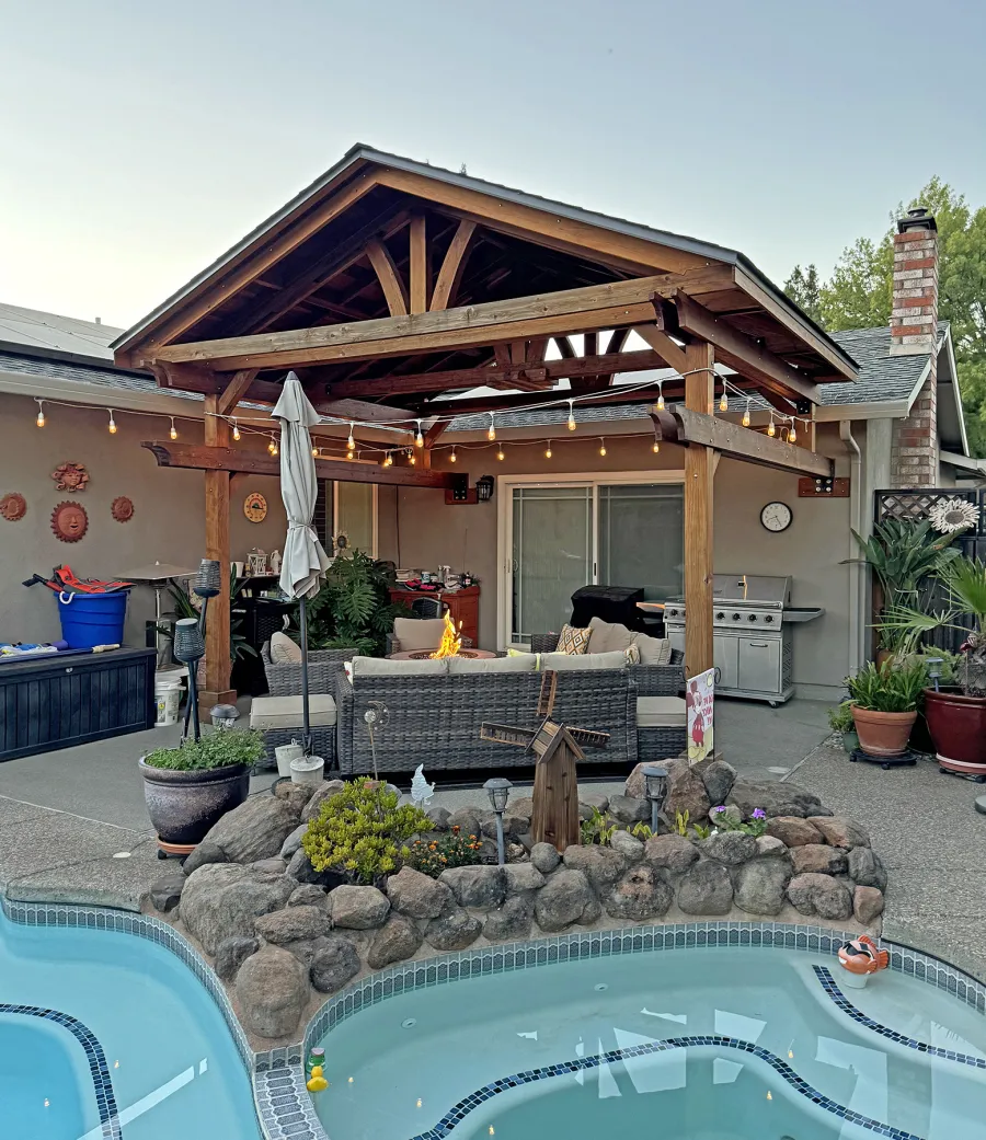 Custom Del Norte Porch Pavilion (Options: 14' L x 16' W, California Redwood, 2-Post Anchor Kit for Concrete, 10.5' H Posts, 1 Ceiling Fan Base, No Electrical Wiring Trim Kit, No Post Decorative Trims, Transparent Premium Sealant). Photo Taken 2 Years After Installation. Photo Courtesy of R. Dakin of Vacaville, CA.