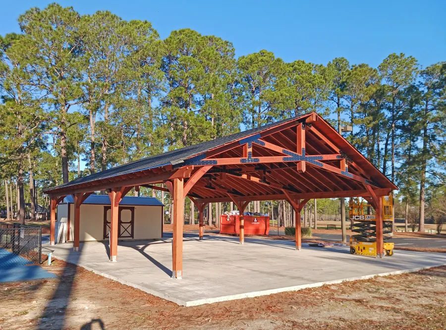 Esther Scissor Truss Pavilion (Options: 45’ L x 35’ W, California Redwood, Standard 3/4" T&G Roof Boards, 10' H Posts, with 3 Ceiling Fan Bases, 8 High-Wind Post Anchors, Transparent Premium Sealant). Photo Courtesy of F. Parini of Myrtle Beach, South Carolina.