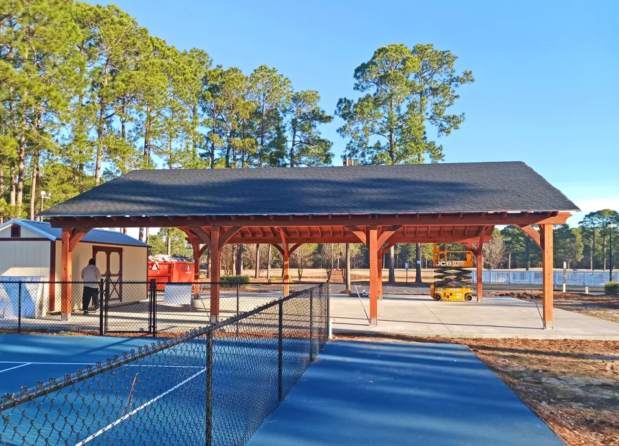 Esther Scissor Truss Pavilion (Options: 45’ L x 35’ W, California Redwood, Standard 3/4" T&G Roof Boards, 10' H Posts, with 3 Ceiling Fan Bases, 8 High-Wind Post Anchors, Transparent Premium Sealant). Photo Courtesy of F. Parini of Myrtle Beach, South Carolina.