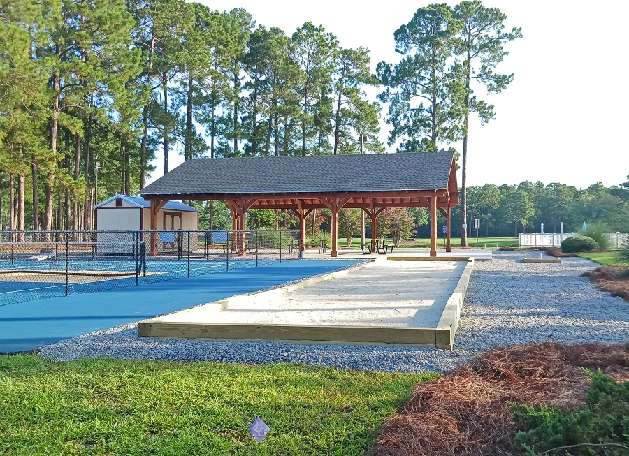 Esther Scissor Truss Pavilion (Options: 45’ L x 35’ W, California Redwood, Standard 3/4" T&G Roof Boards, 10' H Posts, with 3 Ceiling Fan Bases, 8 High-Wind Post Anchors, Transparent Premium Sealant). Photo Courtesy of F. Parini of Myrtle Beach, South Carolina.