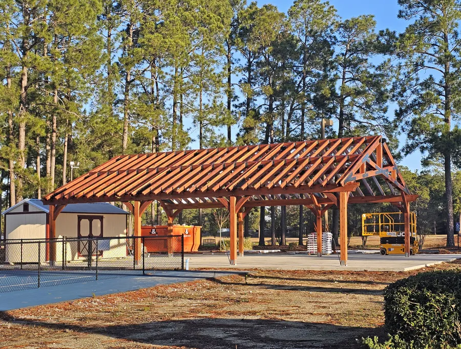 Esther Scissor Truss Pavilion (Options: 45’ L x 35’ W, California Redwood, Standard 3/4" T&G Roof Boards, 10' H Posts, with 3 Ceiling Fan Bases, 8 High-Wind Post Anchors, Transparent Premium Sealant). Photo Courtesy of F. Parini of Myrtle Beach, South Carolina.