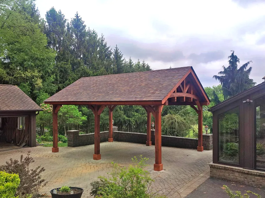 Granada Pavilion (Options: 8in x 8in Post Thickness, 24' L x 18' W, No Privacy Panels, Mature Redwood, with Fascia Boards, 9.5 ft Post Height, Electrical Wiring Trim for 2 Posts, No Post Decorative Trim, 6-Post Anchor Kit for High-Wind, No Ceiling Fan Base, No Curtain Rods, Transparent Premium Sealant). Photo Courtesy of A. Czysz of New Tripoli, Pennsylvania.
