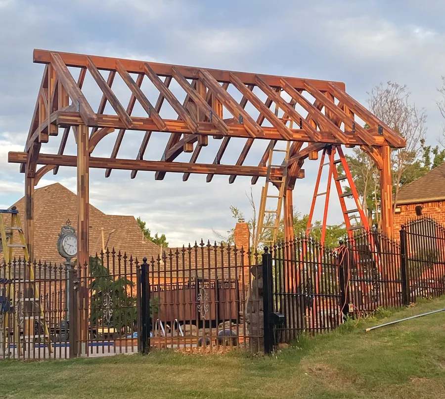 Custom Granada Pavilion Under Construction (Options: 20 ft x 15 ft, Mosaic Redwood, 4-Post Anchor Kit for High-Wind, No Fascia Board, No Curtain Rods, 3 Ceiling Fan Bases, Transparent Premium Sealant). Shake from DaVinci Roof [https://www.davinciroofscapes.com/]. Photo Courtesy of K. Lowe of Newcastle, Oklahoma.