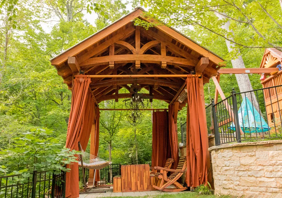 Granada Pavilion (Options: 6in x 6in post thickness, 18' L x 15' W, No Privacy Panels, California Redwood, No Fascia Board for Gutters, 10.5ft Post Height, 1 Electrical Wiring Trim, No Post Decorative Trim, 4-Post Anchor Kit for High-Wind, 3 Ceiling Fan Bases (CUSTOM REQUEST), 4 Heavy Duty Curtain Rods & Stainless Steel Hangars, Transparent Premium Sealant). Photo Courtesy of J. Rynerson of Franklin, Tennessee.