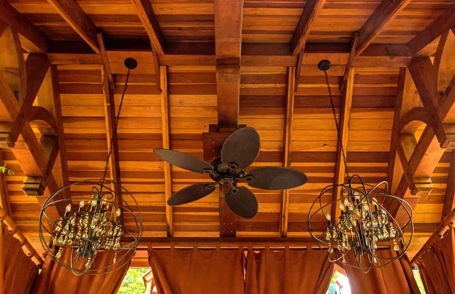 Granada Pavilion (Options: 6in x 6in post thickness, 18' L x 15' W, No Privacy Panels, California Redwood, No Fascia Board for Gutters, 10.5ft Post Height, 1 Electrical Wiring Trim, No Post Decorative Trim, 4-Post Anchor Kit for High-Wind, 3 Ceiling Fan Bases (CUSTOM REQUEST), 4 Heavy Duty Curtain Rods & Stainless Steel Hangars, Transparent Premium Sealant). Photo Courtesy of J. Rynerson of Franklin, Tennessee.