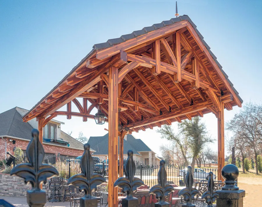 Custom Granada Pavilion (Options: 20 ft x 15 ft, Mosaic Redwood, 4-Post Anchor Kit for High-Wind, No Fascia Board, No Curtain Rods, 3 Ceiling Fan Bases, Transparent Premium Sealant). Shake from DaVinci Roof [https://www.davinciroofscapes.com/]. Photo Courtesy of K. Lowe of Newcastle, Oklahoma.